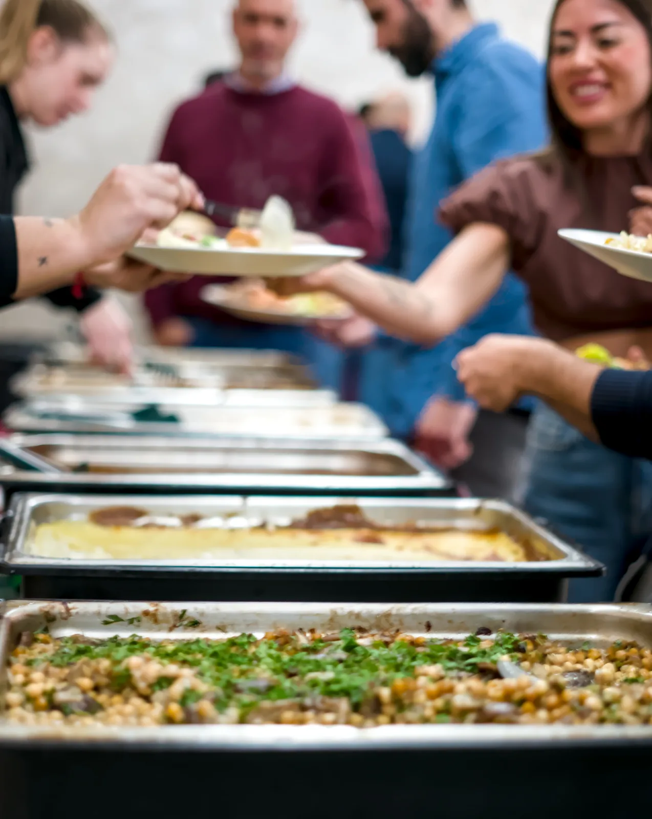 Employees self-serving from GN trays in an urban corporate canteen